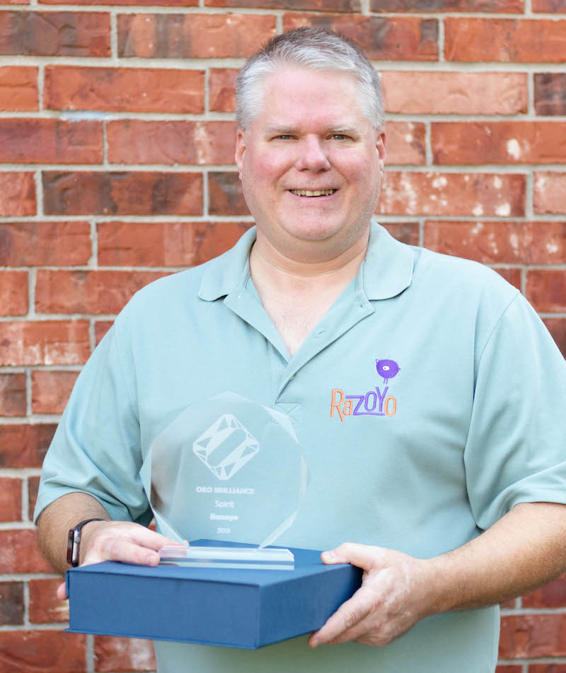 President Paul Byrne holding award trophy